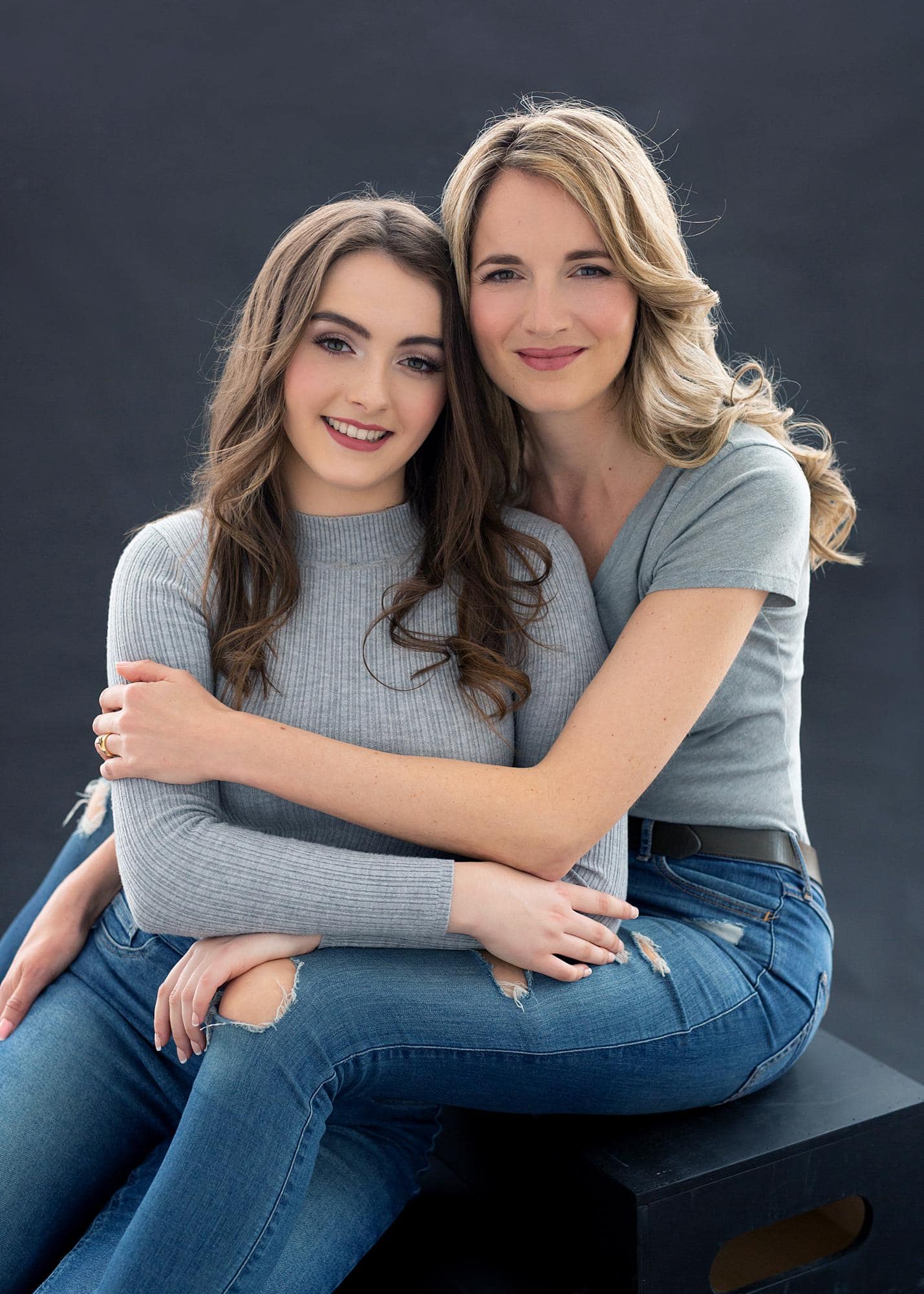 Mother and daughter pose for Beauty Shoot Photoshoot in a Suffolk studio wearing jeans and grey tshirts