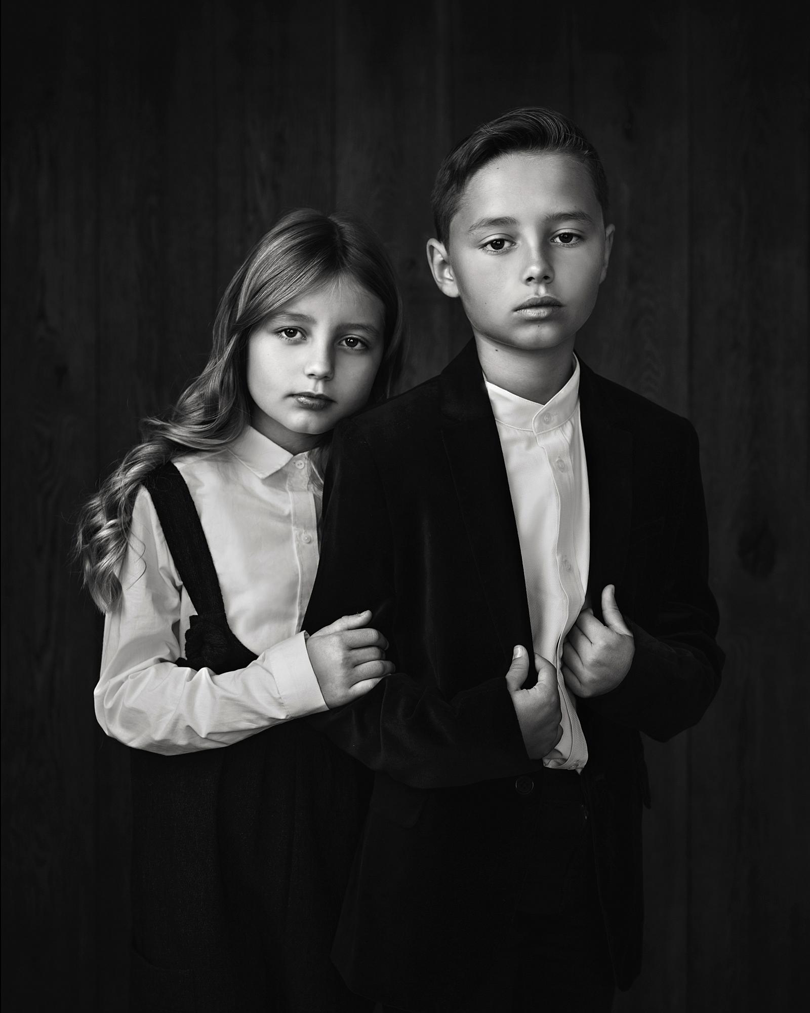 Black and white fine art portrait of a Brother and Sister in vintage clothes