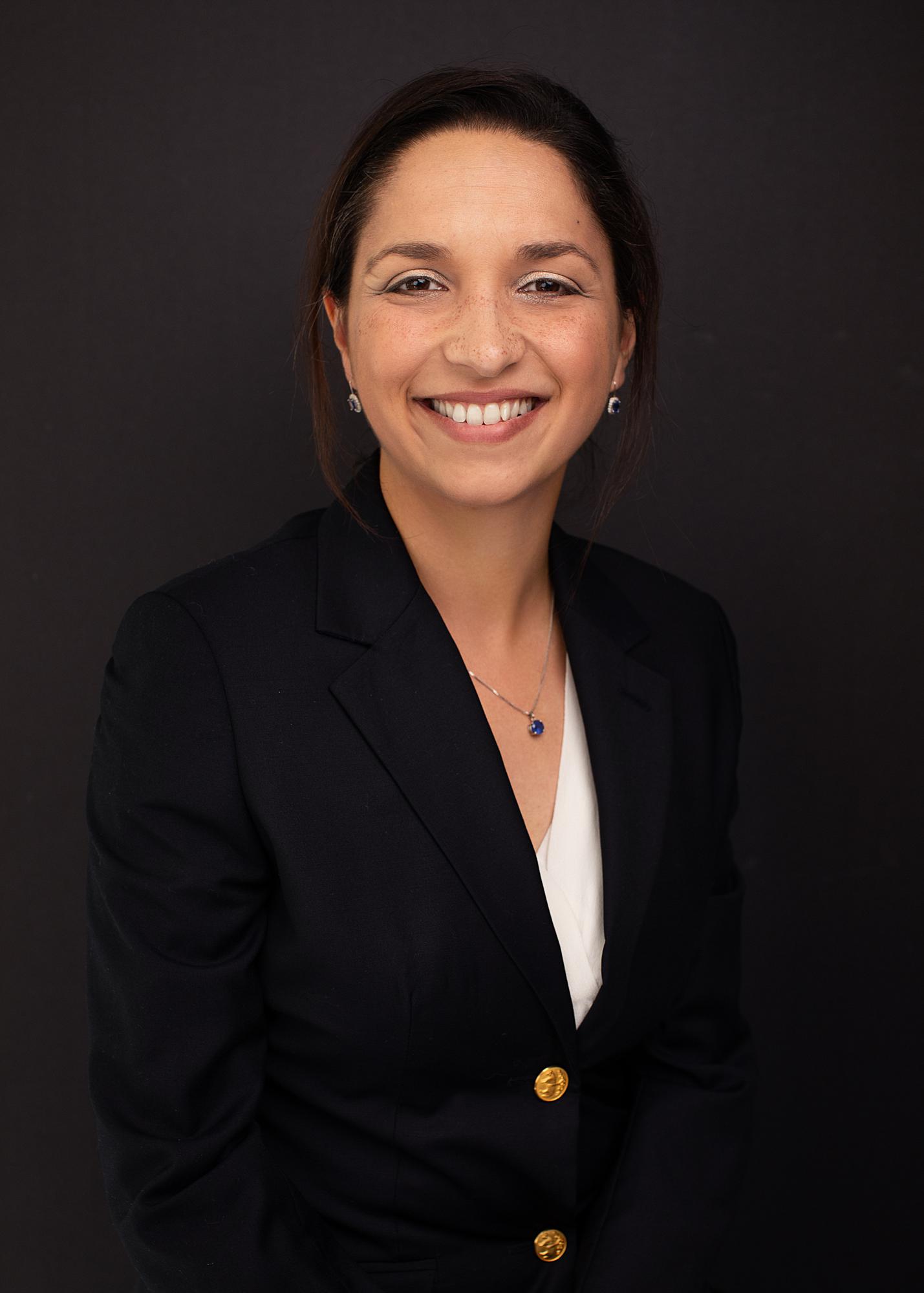 Woman smiling in a suit at a Personal Branding Photoshoot in Suffolk