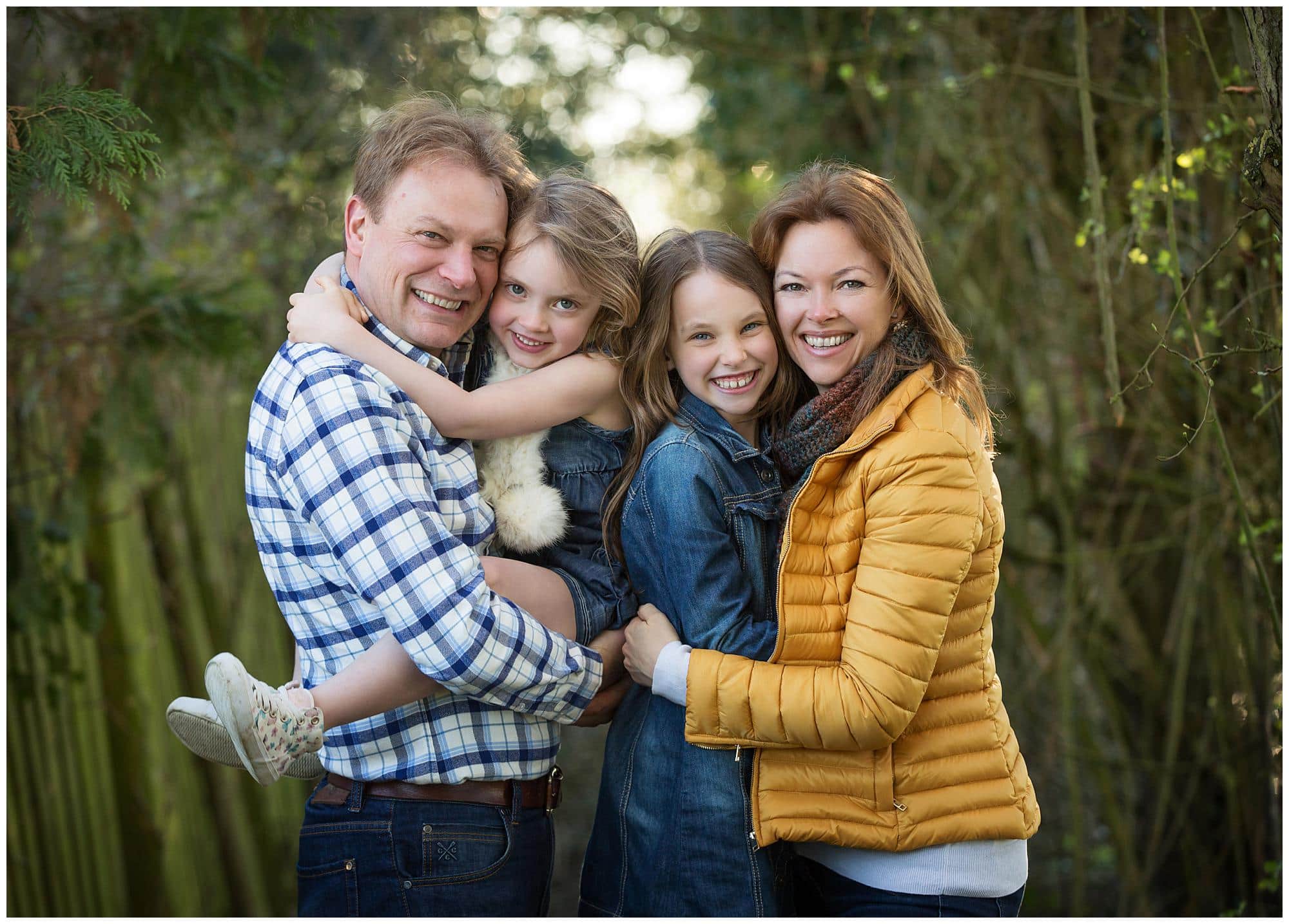Family of four pose for an Outdoor Photoshoot in Suffolk
