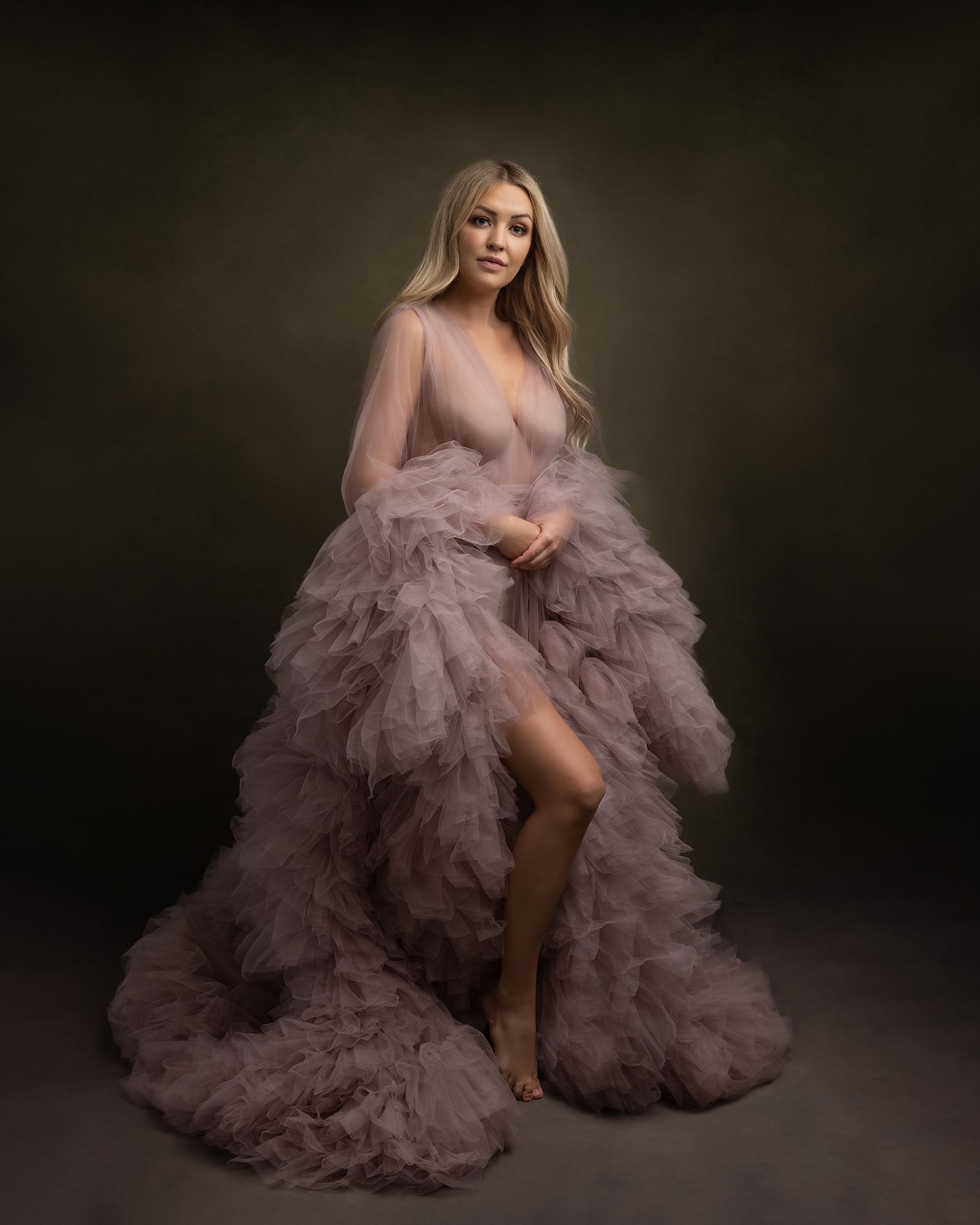 Blonde woman wears a pink tulle gown during her Beauty Photo shoot in Suffolk Studio