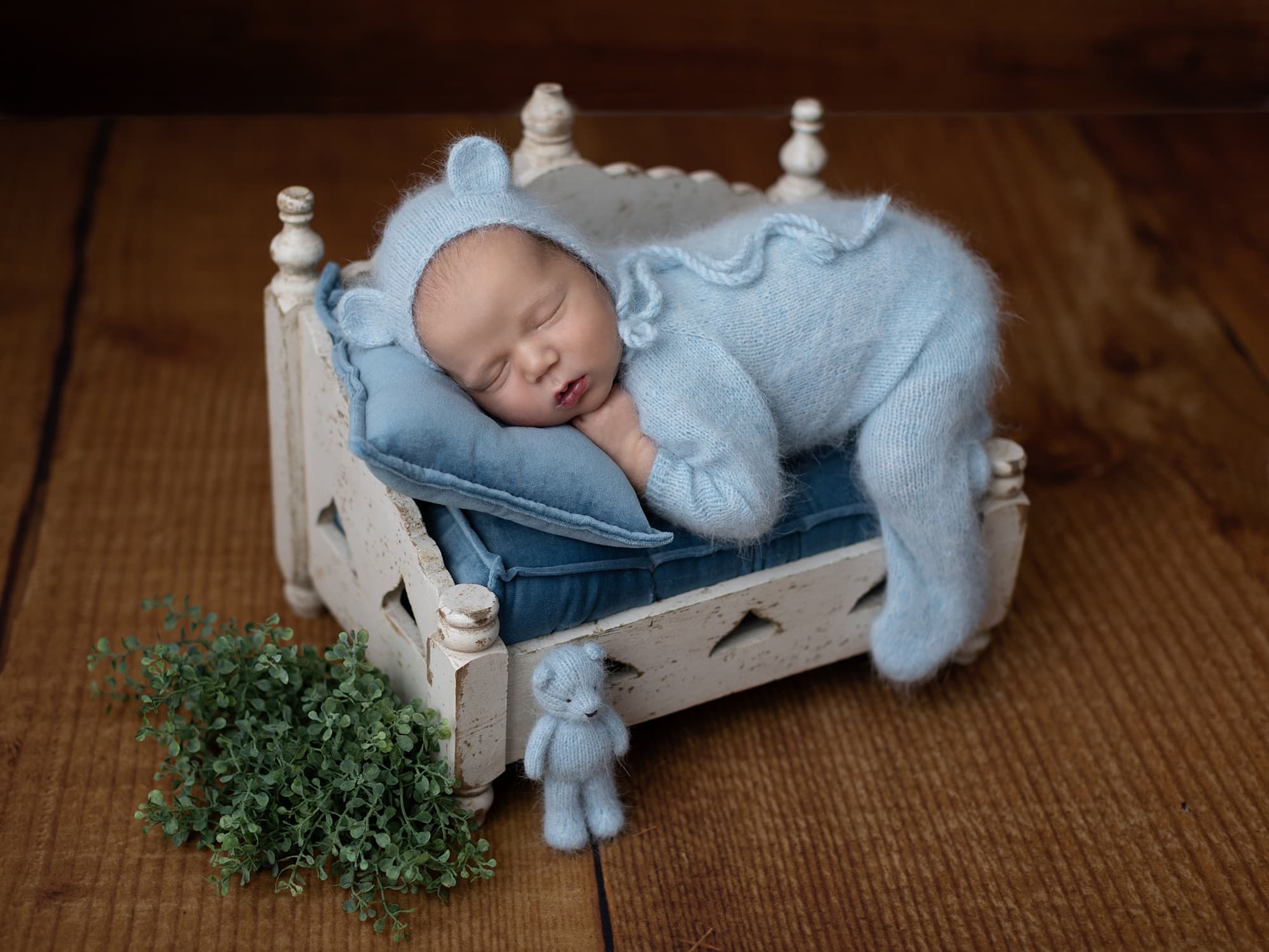 Newborn Baby Photographer Haverhill photographs baby boy on white day bed
