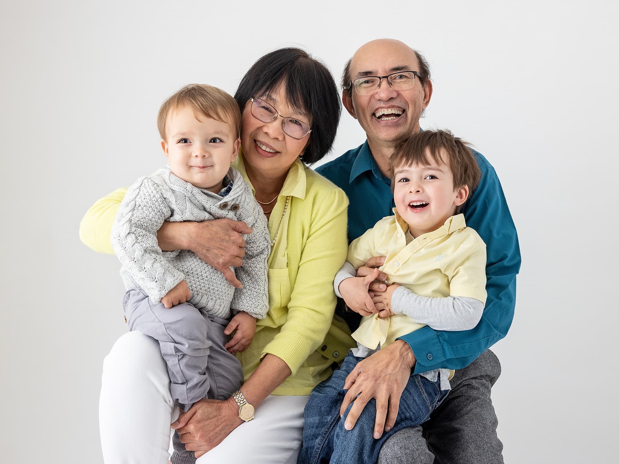 Grandparents and Grandkids smiling during a family portrait shoot