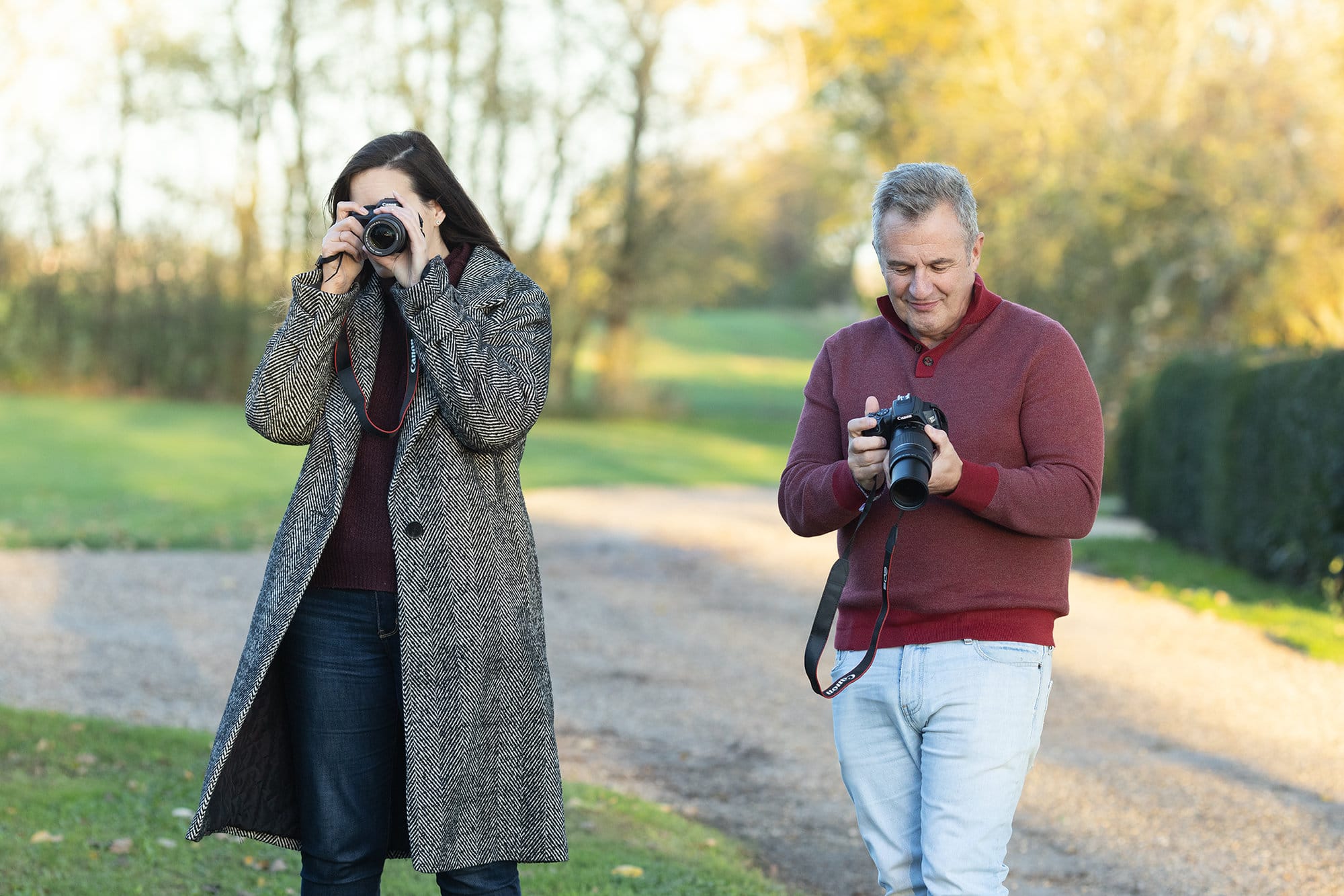 Two ameteur photographers practice what they have learnt at Alison McKenny Photography's Beginner Workshop in Suffolk