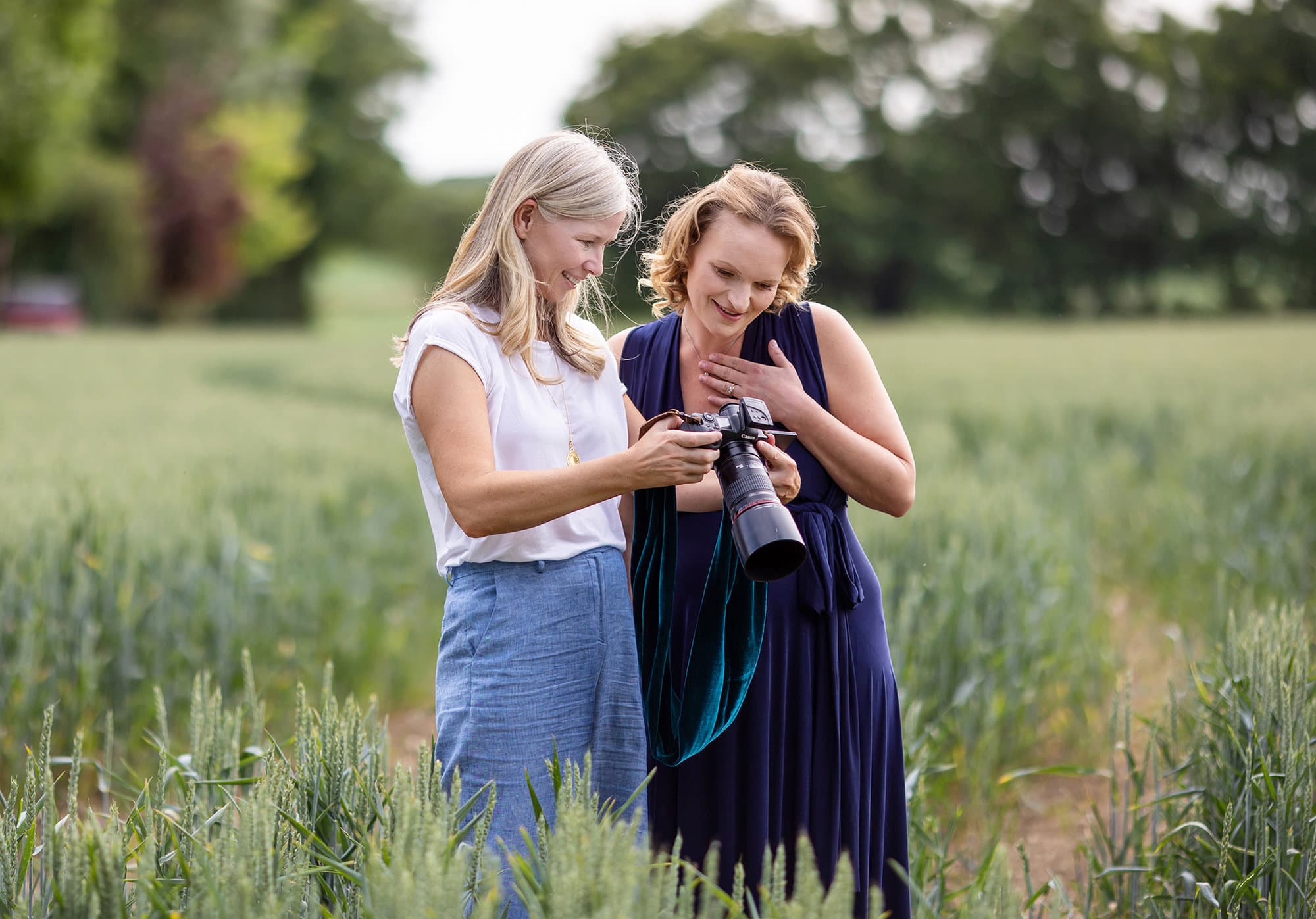 Alison McKenny shows her photos to a Maternity Client during Beginners Photography Workshop on Suffolk farm