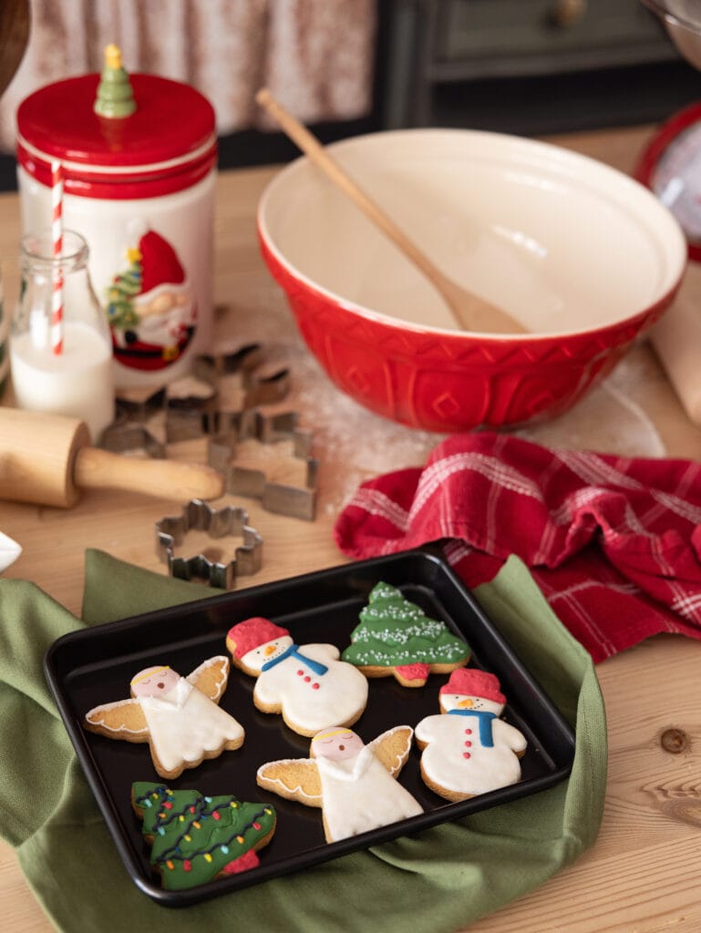 Christmas cookies on a baking tray in a Christmas Mini Session set at Alison McKenny Photographys studio in Suffolk
